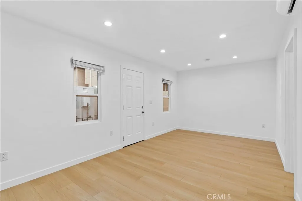 10112 Fernglen Avenue Tujunga, CA 91042 - Photo 12 of 12 an empty room with a empty space and windows