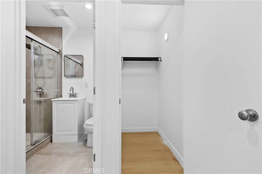10112 Fernglen Avenue Tujunga, CA 91042 - Photo 8 of 12 a bathroom with a sink toilet and shower