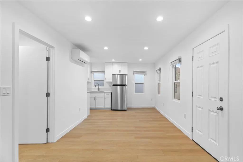 10112 Fernglen Avenue Tujunga, CA 91042 - Photo 10 of 12 a view of a kitchen with refrigerator and white floor