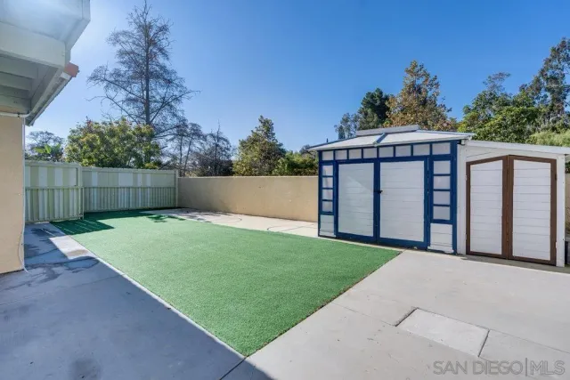 a view of a back yard from a room