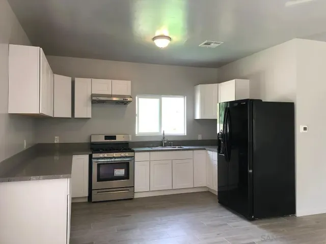 a white toilet sitting next to a bathroom sink