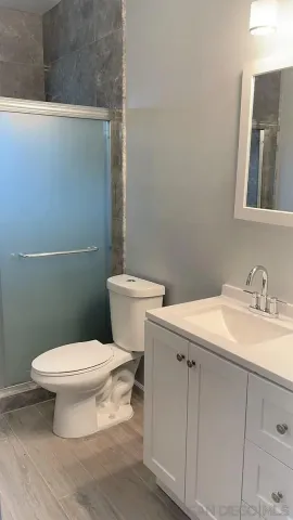 a view of front door with wooden floor