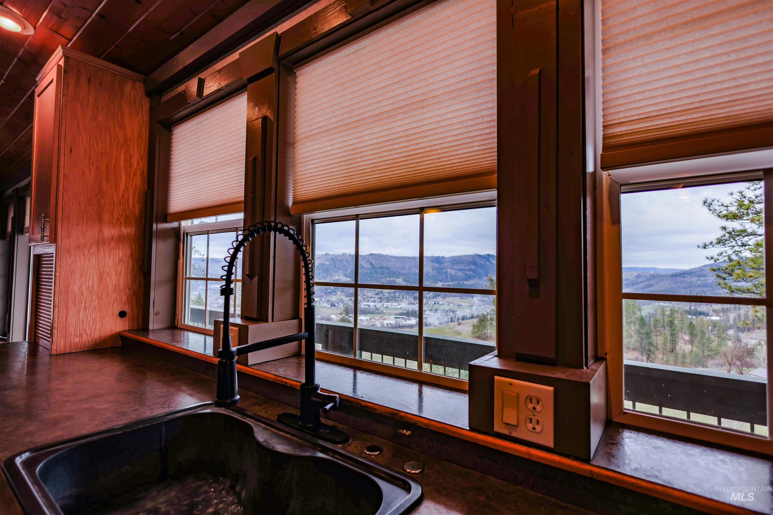 402 Beaverslide Road Kamiah, ID 83536 - Photo 21 of 46 Kitchen view of a mountain backdrop and wooden ceiling