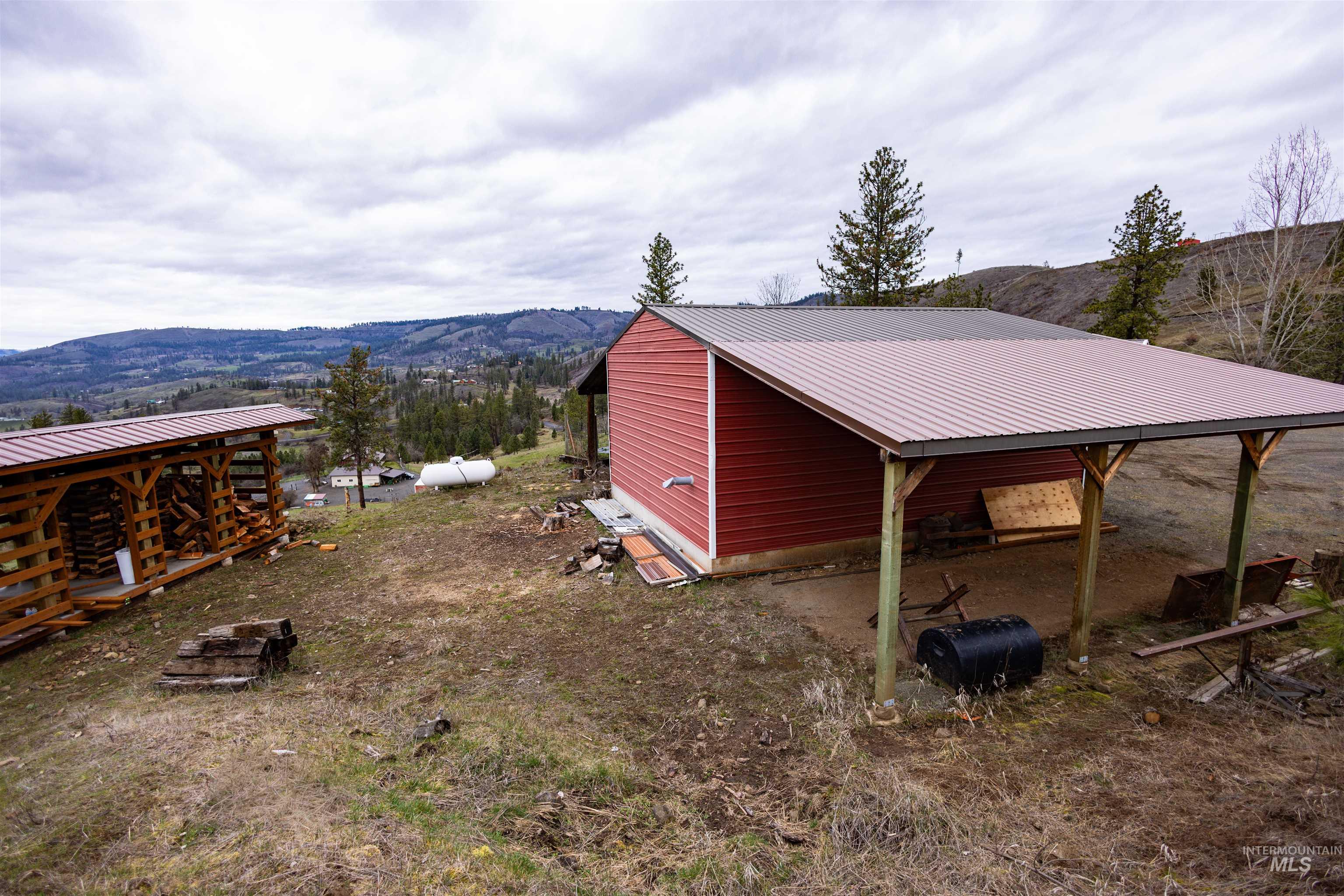 402 Beaverslide Road Kamiah, ID 83536 - Photo 36 of 46 View of yard featuring a mountain view and an outbuilding
