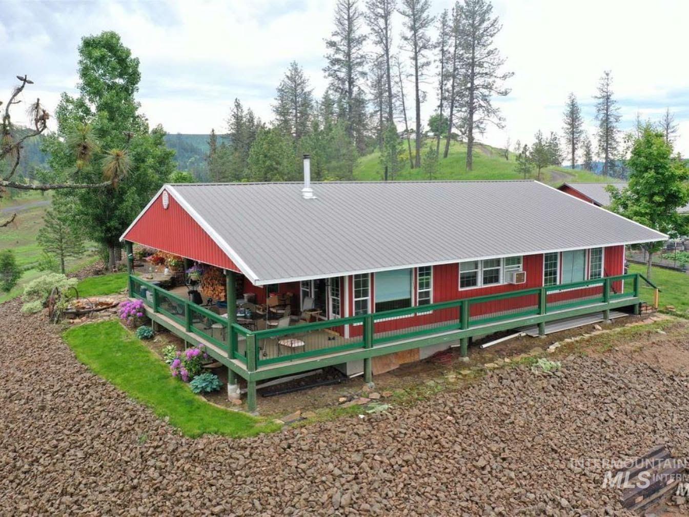 402 Beaverslide Road Kamiah, ID 83536 - Photo 8 of 46 Back of property featuring a large porch and a metal roof