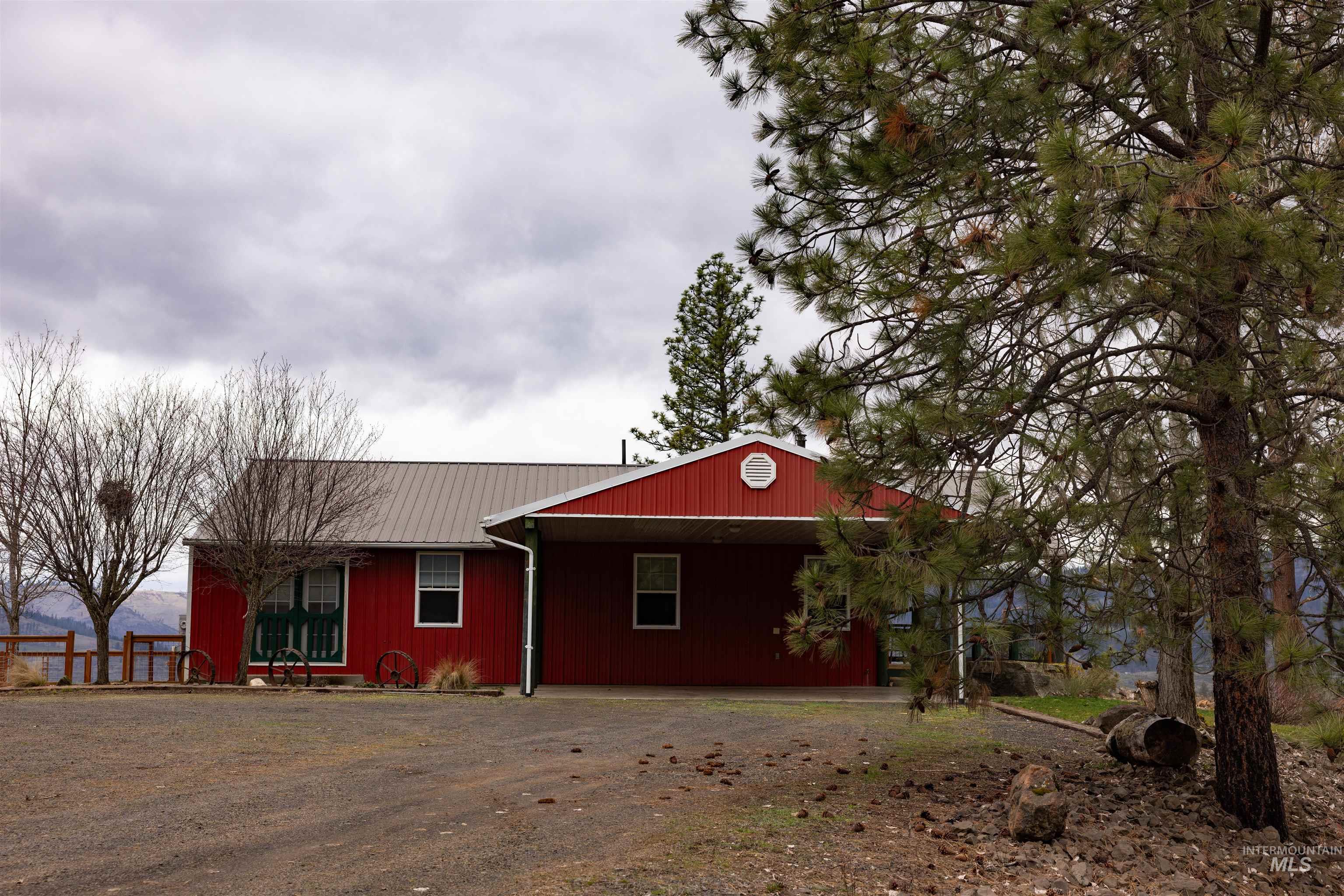 402 Beaverslide Road Kamiah, ID 83536 - Photo 10 of 46 View of front of home with a metal roof and driveway