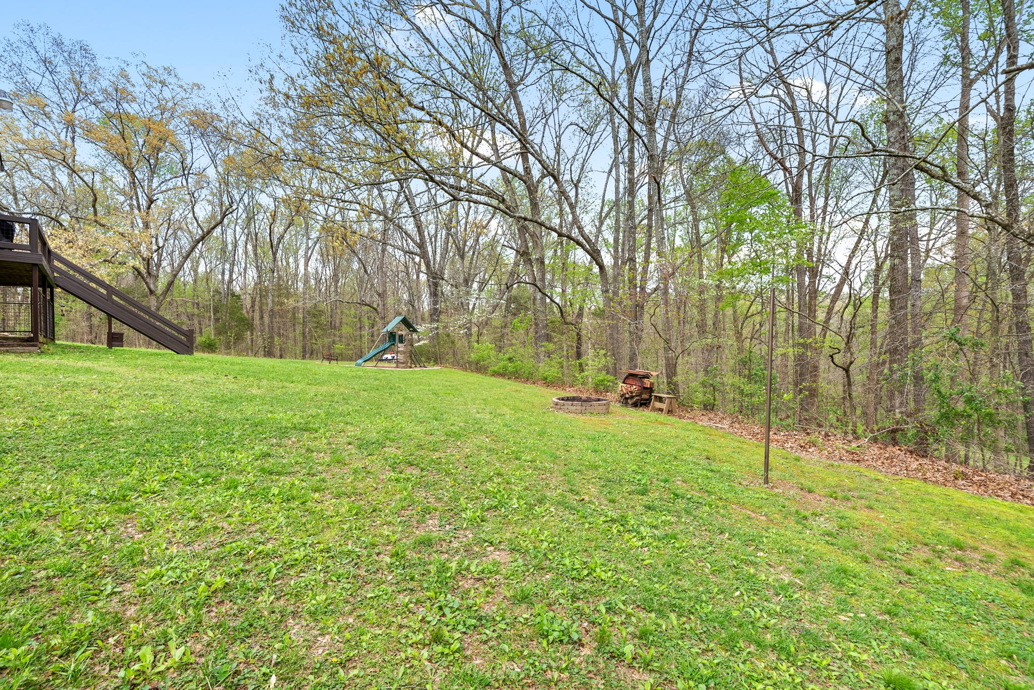 4813 Henry Gower Road Pleasant View, TN 37146 - Photo 34 of 49 a view of a backyard with large trees
