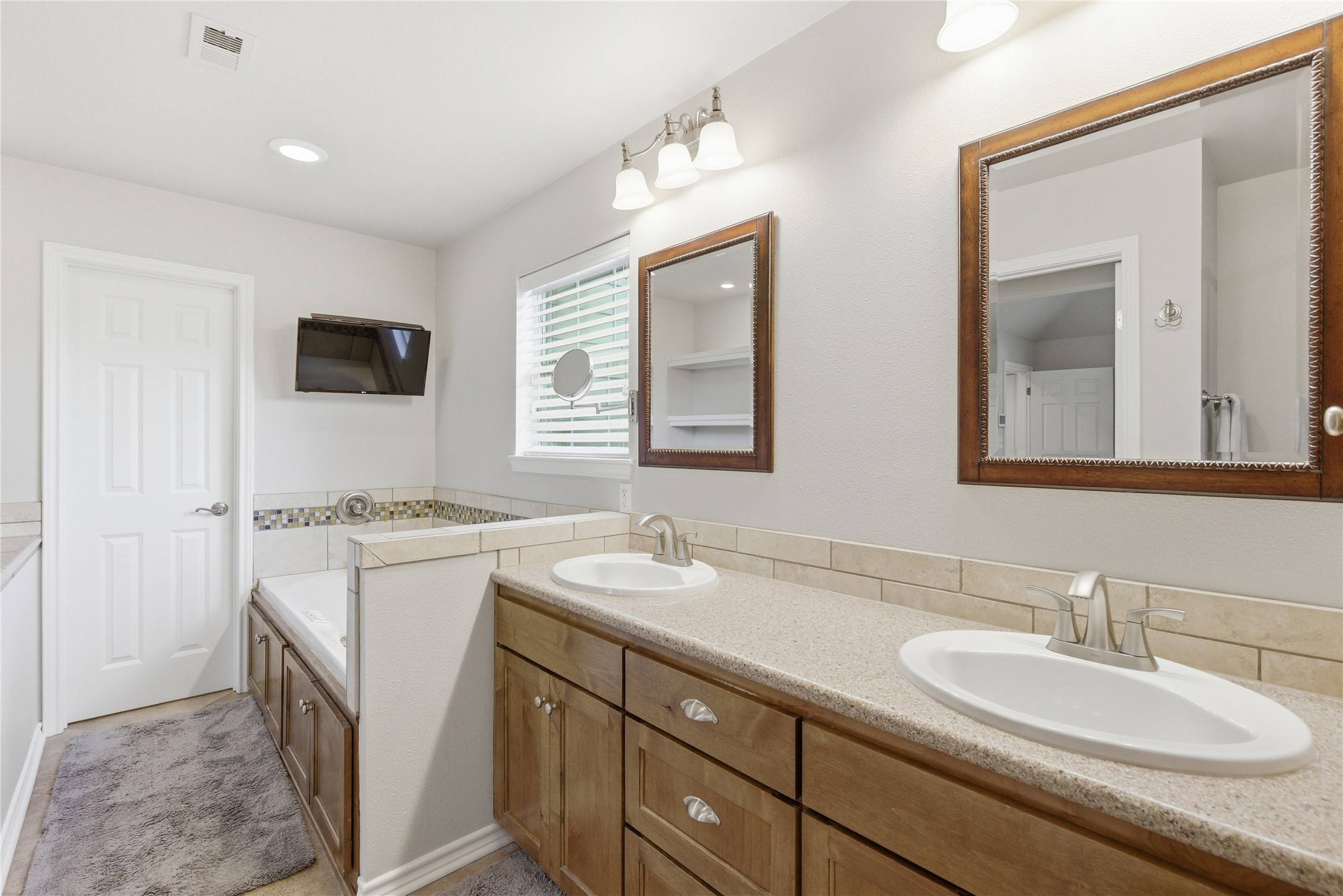 1204 Orlando Road Austin, TX 78733 - Photo 10 of 40 Double vanity and a deep soaking tub create a personal spa retreat.