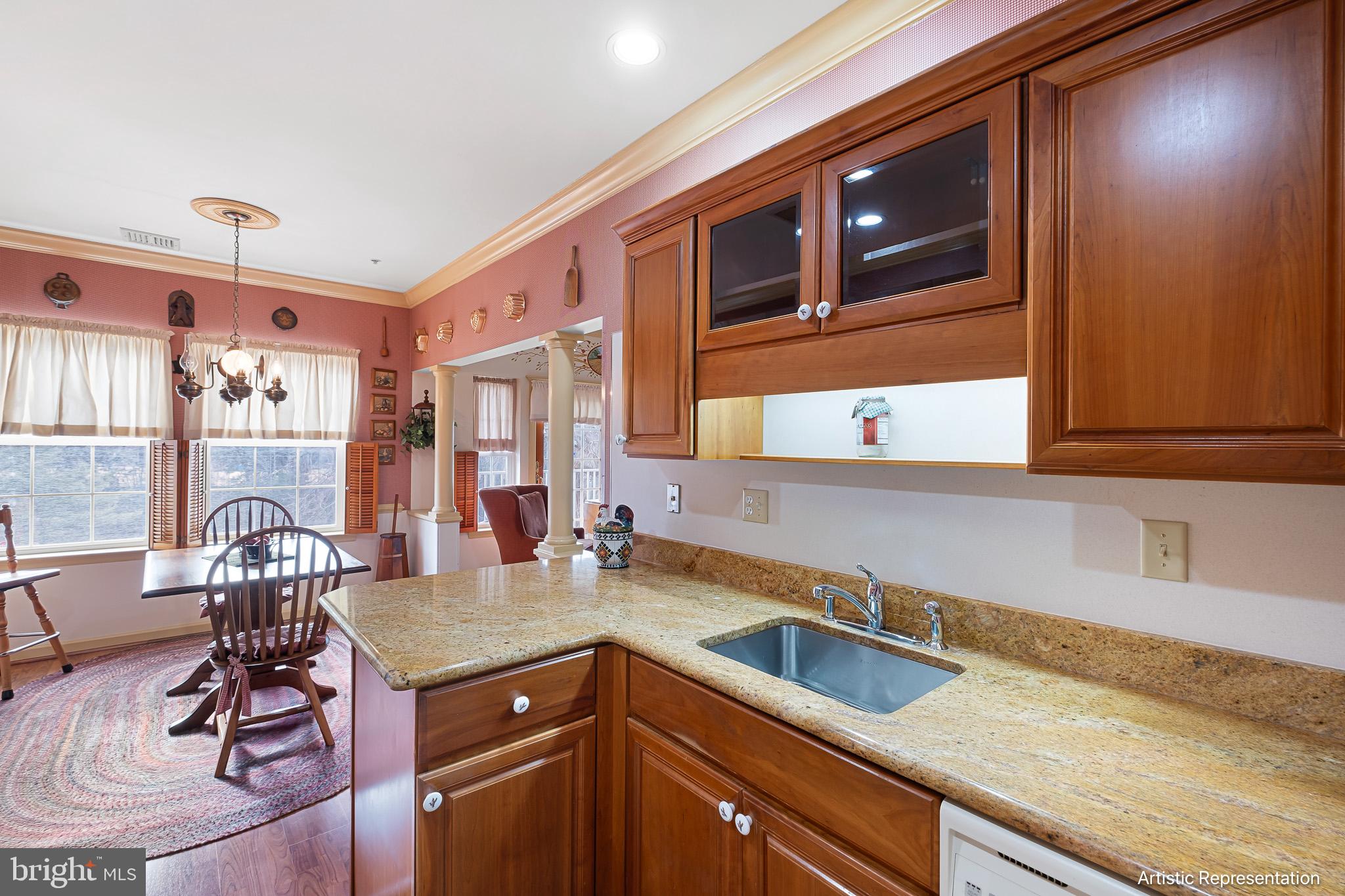 1515 Rockland Road, Unit 301 Wilmington, DE 19803 - Photo 12 of 49 a kitchen with a sink cabinets and stove