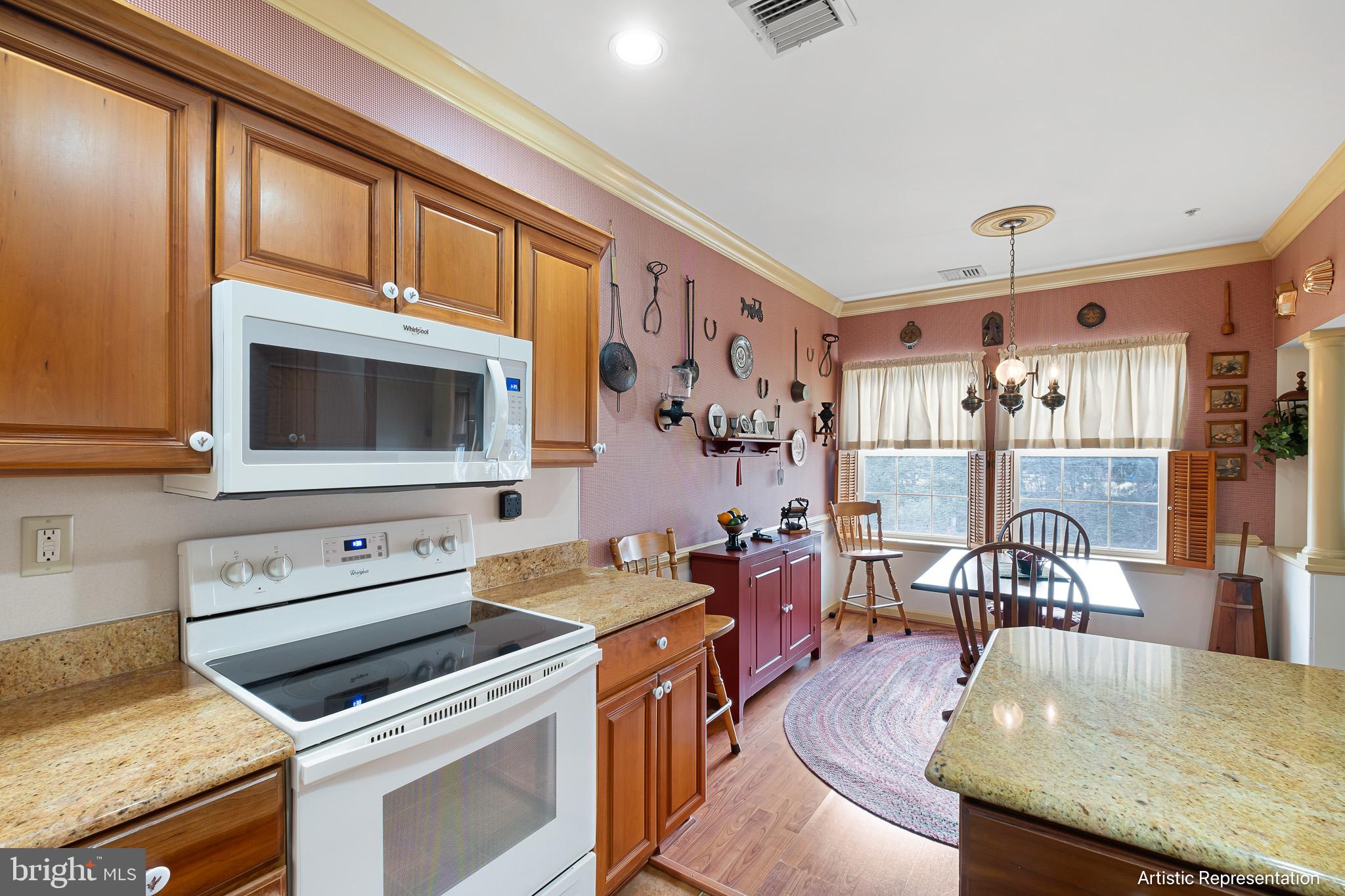 1515 Rockland Road, Unit 301 Wilmington, DE 19803 - Photo 13 of 49 a kitchen with a stove a sink and a microwave