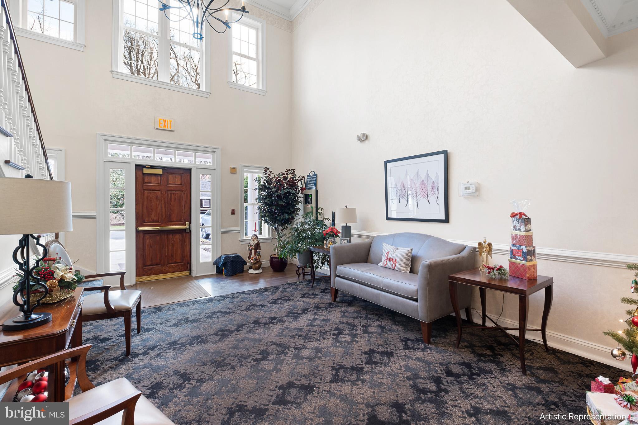 1515 Rockland Road, Unit 301 Wilmington, DE 19803 - Photo 2 of 49 a living room with furniture a window and a flat screen tv