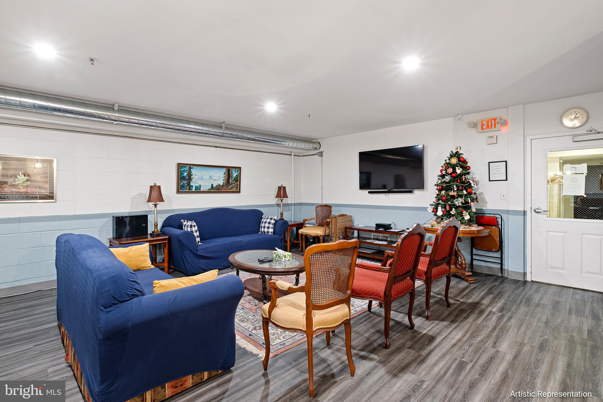 1515 Rockland Road, Unit 301 Wilmington, DE 19803 - Photo 26 of 49 a living room with furniture a flat screen tv and kitchen view