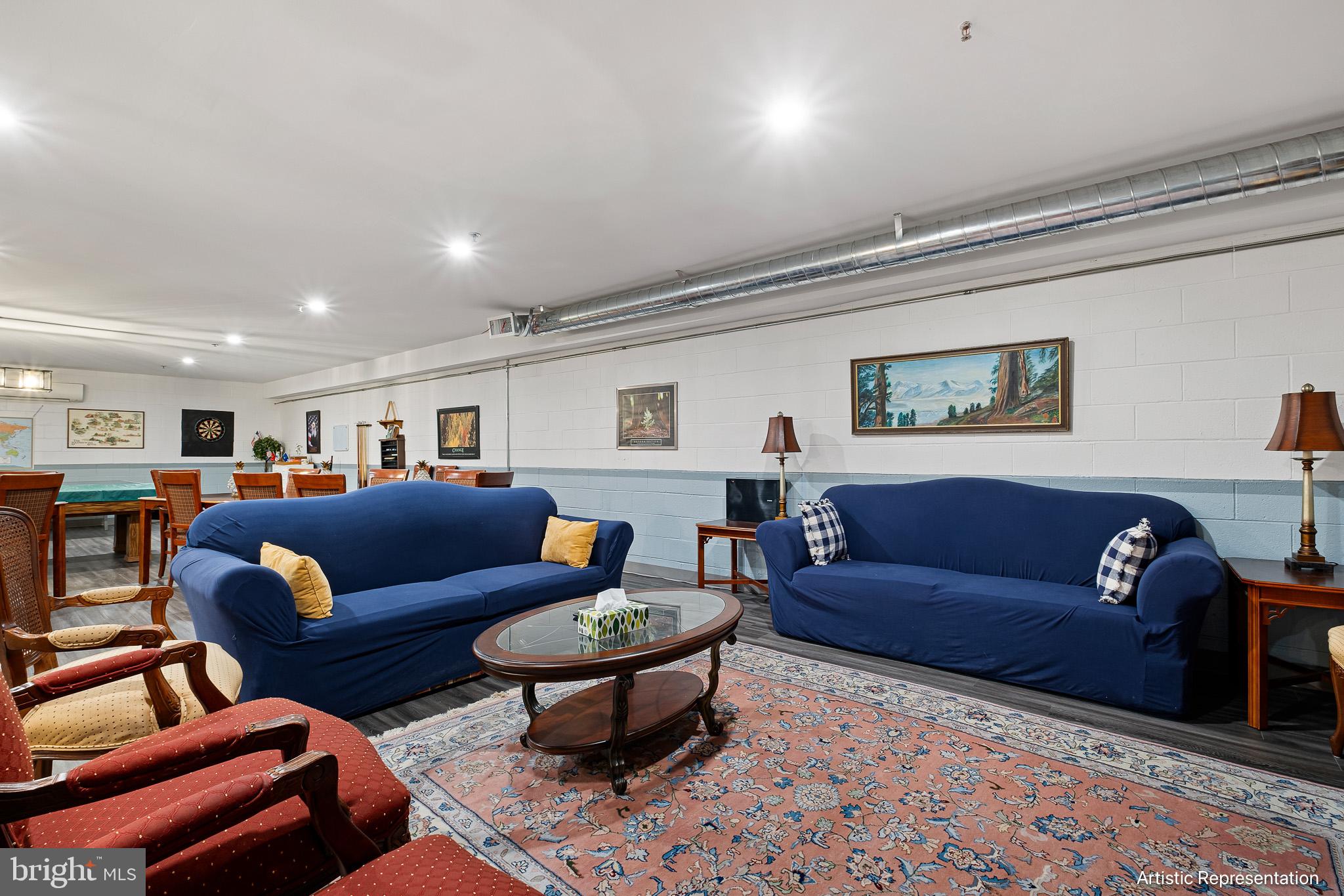 1515 Rockland Road, Unit 301 Wilmington, DE 19803 - Photo 27 of 49 a living room with furniture a rug and a lamp