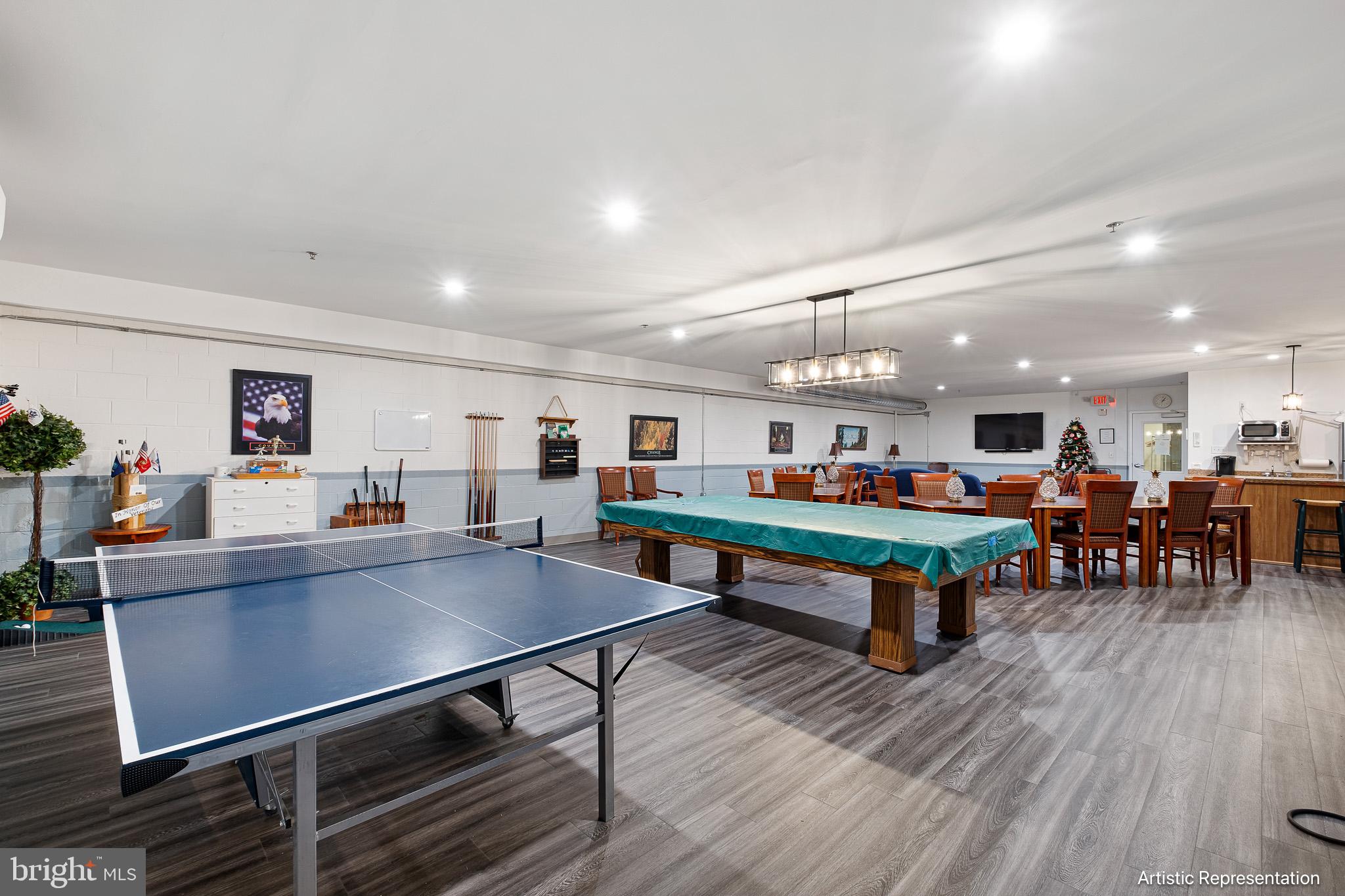 1515 Rockland Road, Unit 301 Wilmington, DE 19803 - Photo 28 of 49 a room with lots of furniture and a wooden floor