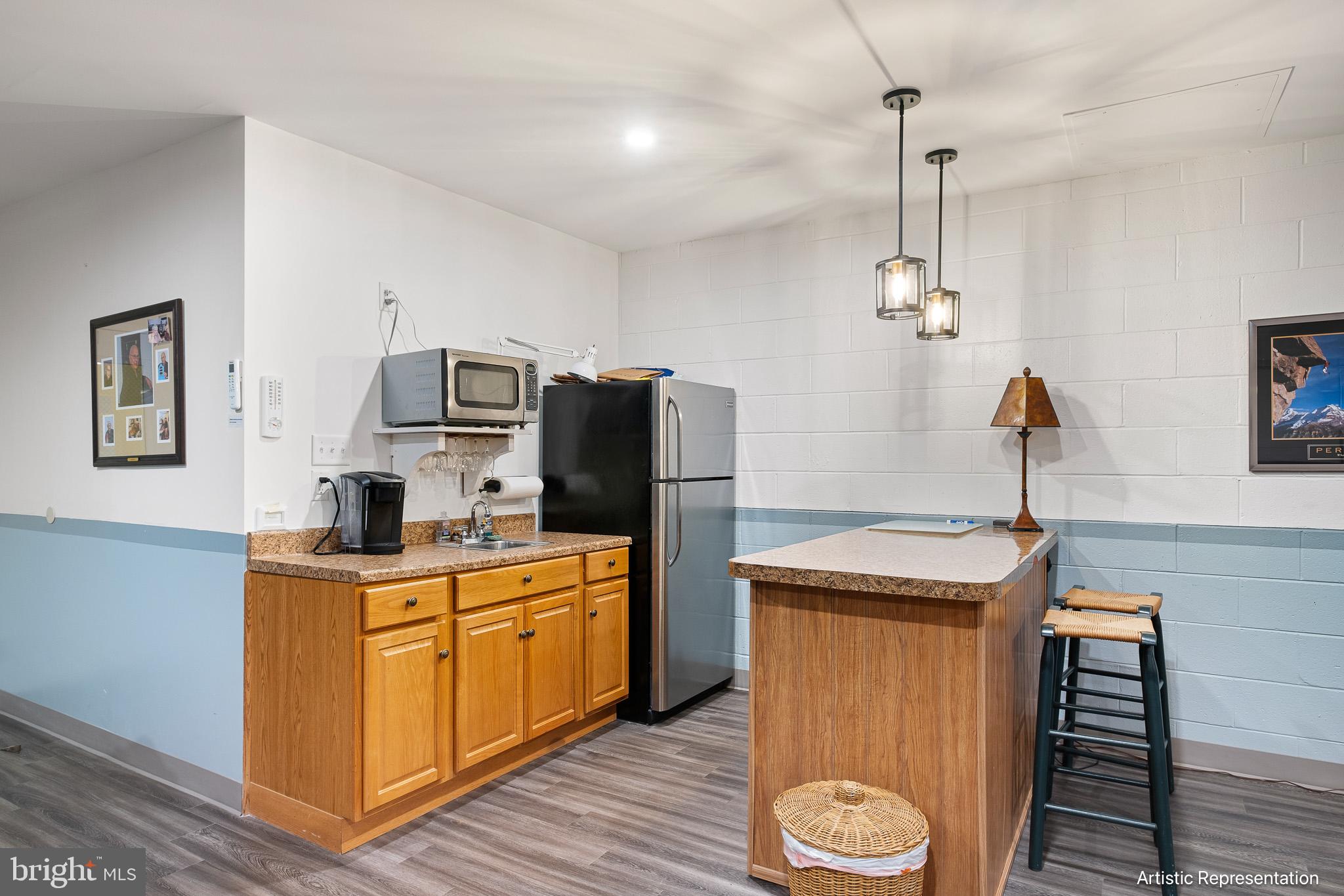 1515 Rockland Road, Unit 301 Wilmington, DE 19803 - Photo 29 of 49 a kitchen with stainless steel appliances granite countertop a sink a stove and refrigerator