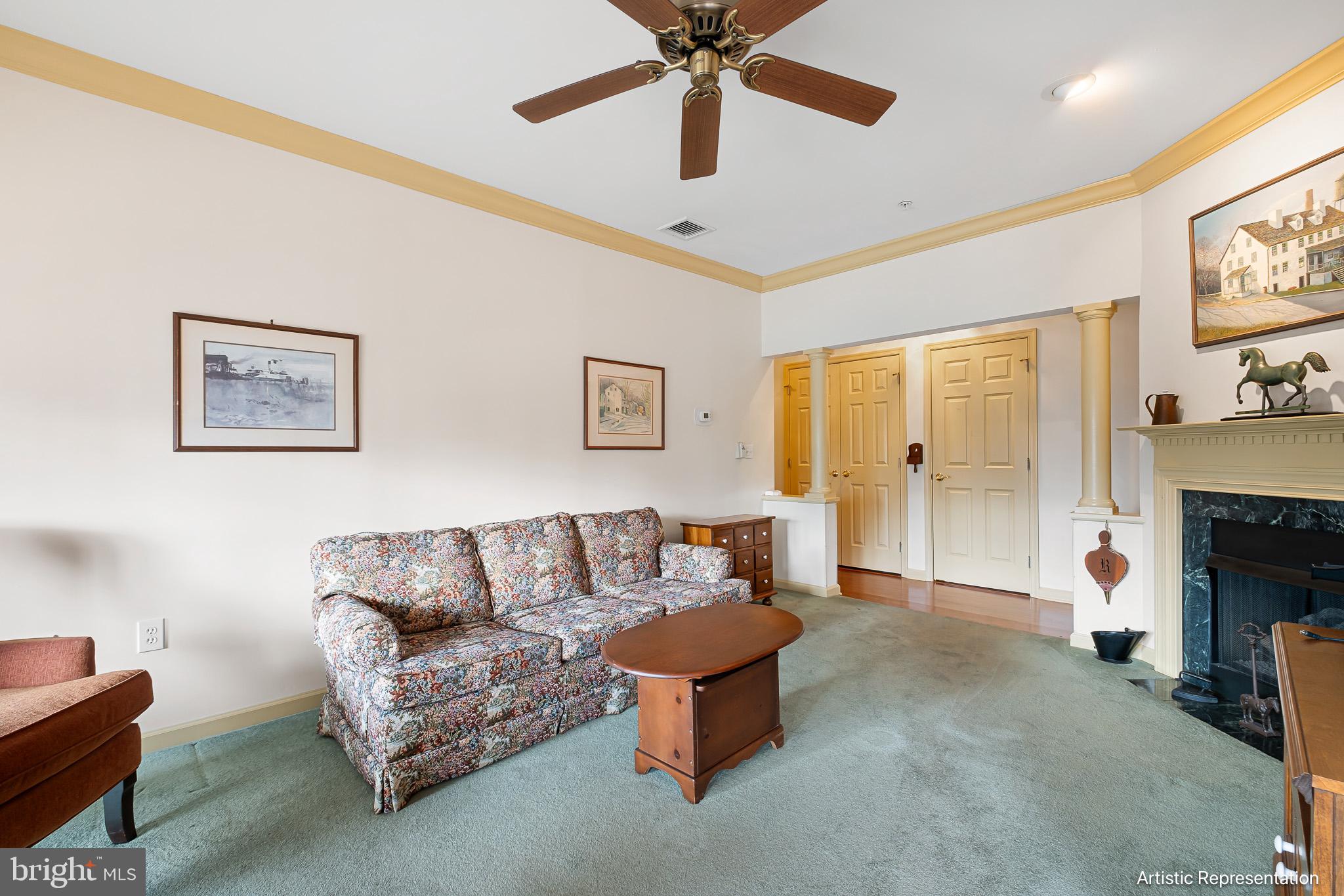 1515 Rockland Road, Unit 301 Wilmington, DE 19803 - Photo 7 of 49 a living room with furniture and a fireplace