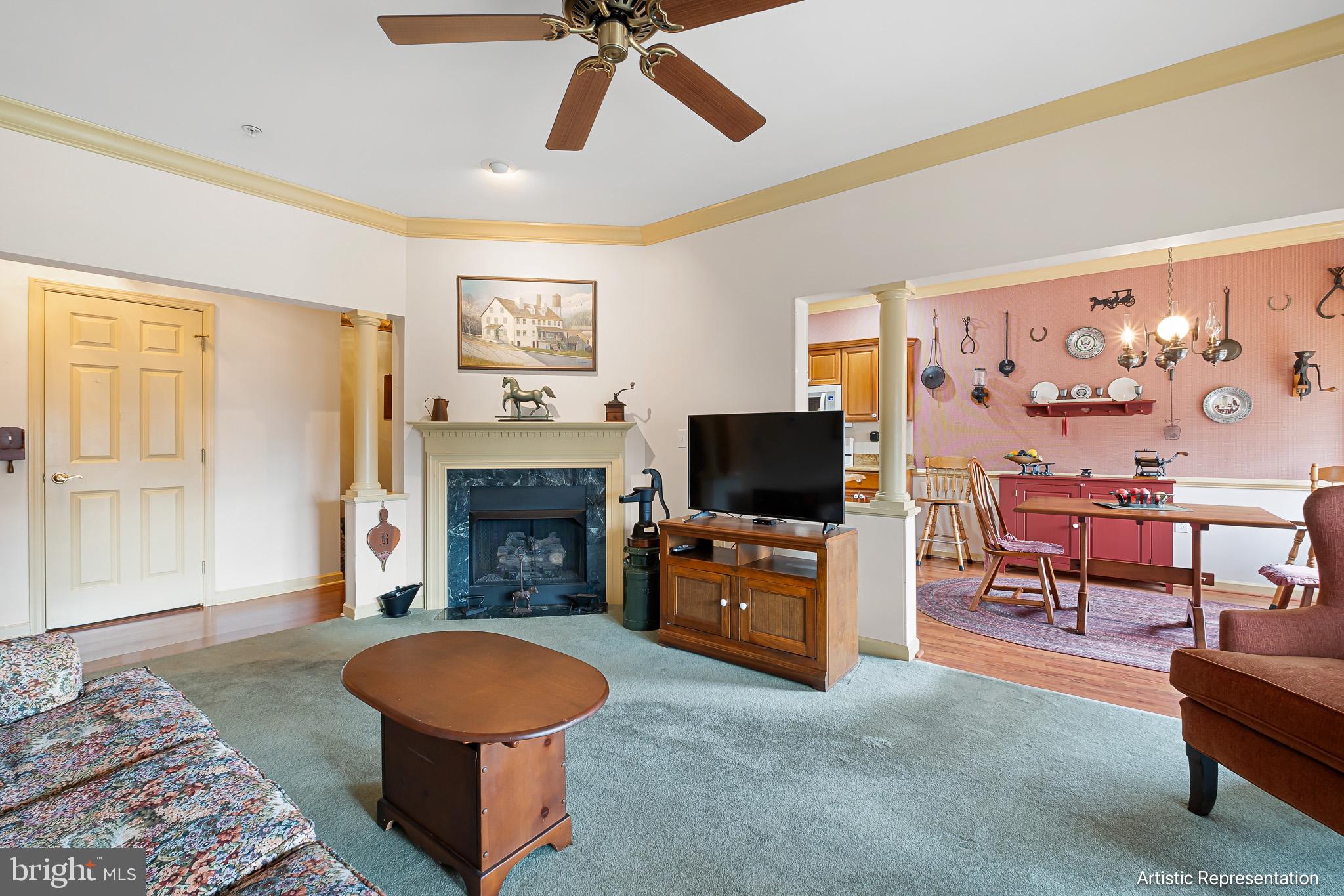 1515 Rockland Road, Unit 301 Wilmington, DE 19803 - Photo 8 of 49 a living room with furniture a flat screen tv and a fireplace