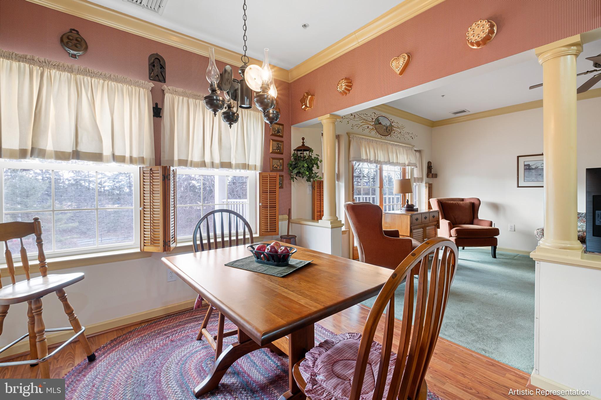 1515 Rockland Road, Unit 301 Wilmington, DE 19803 - Photo 9 of 49 a view of a dining room with furniture window and wooden floor