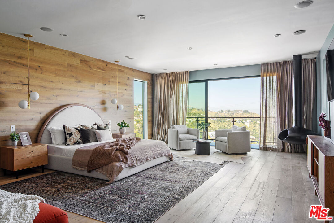 2181 Beech Knoll Road Los Angeles, CA 90046 - Photo 12 of 30 a living room with furniture and a large window