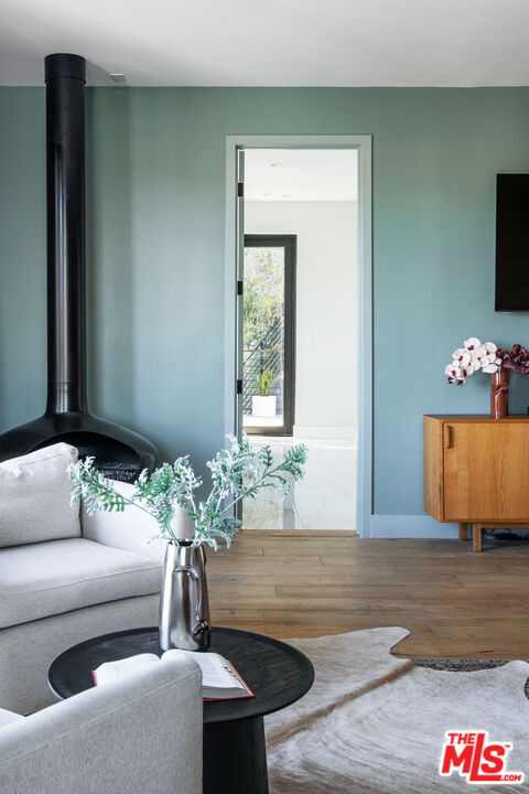 2181 Beech Knoll Road Los Angeles, CA 90046 - Photo 15 of 30 a living room with furniture and a potted plant
