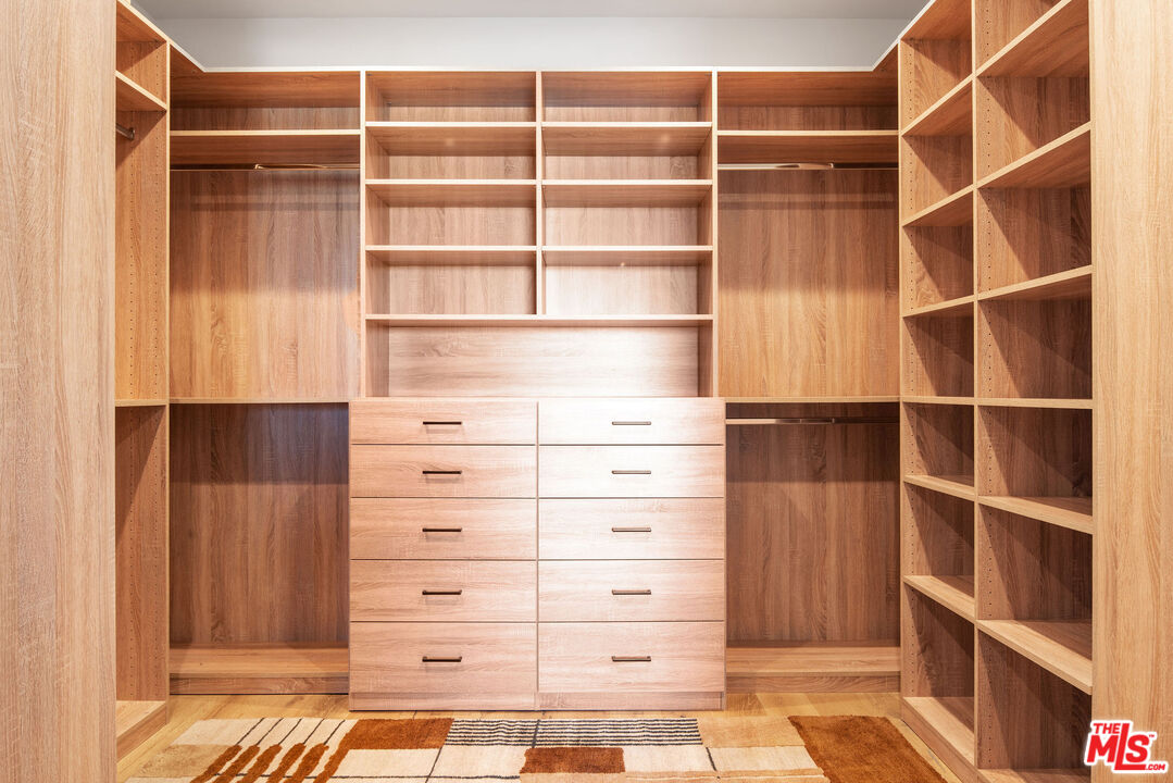 2181 Beech Knoll Road Los Angeles, CA 90046 - Photo 20 of 30 a view of walk in closet with empty racks
