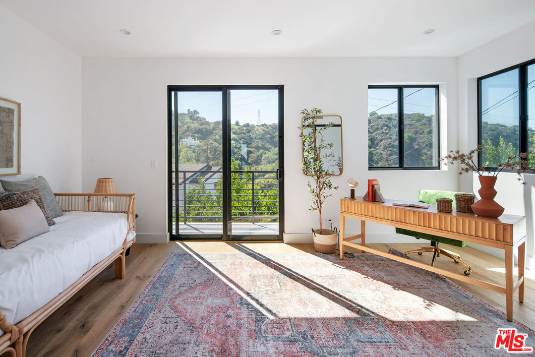 2181 Beech Knoll Road Los Angeles, CA 90046 - Photo 21 of 30 a living room with furniture and a large window