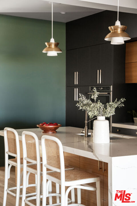 2181 Beech Knoll Road Los Angeles, CA 90046 - Photo 8 of 30 a dining table chairs and a chandelier