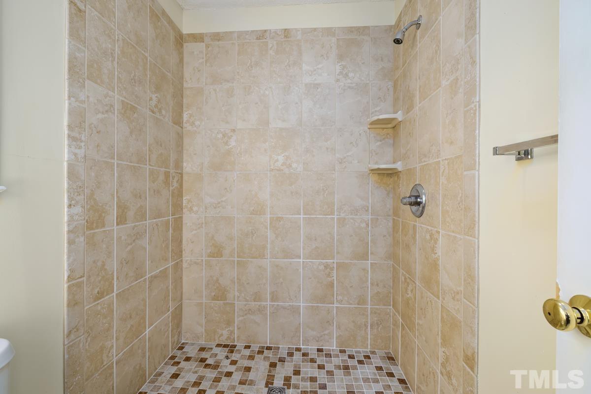 2104 Havering Place Raleigh, NC 27604 - Photo 13 of 13 a bathroom with a shower