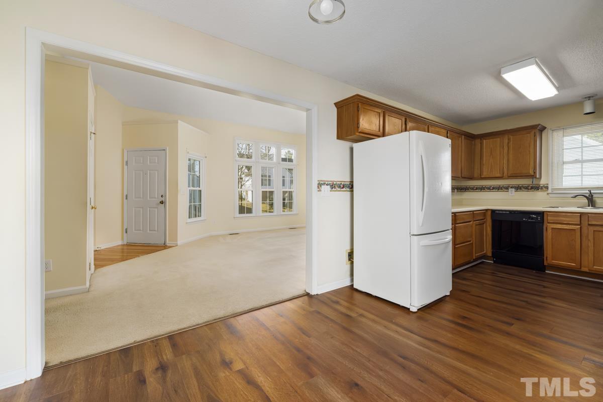 2104 Havering Place Raleigh, NC 27604 - Photo 5 of 13 a kitchen with a refrigerator and a sink