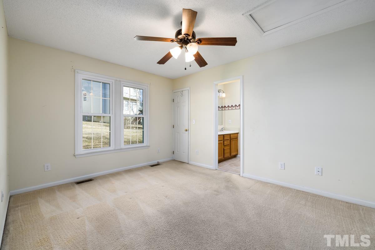 2104 Havering Place Raleigh, NC 27604 - Photo 8 of 13 an empty room with fan and windows