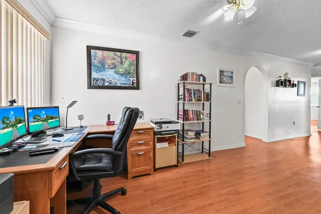 a workspace with furniture and window