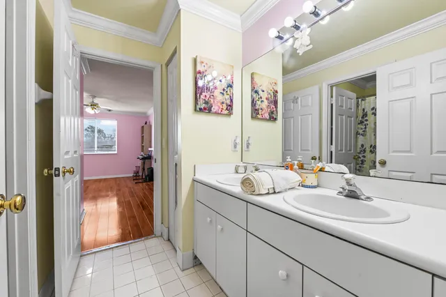 a bathroom with a sink and mirror