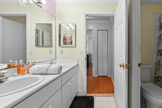 a bathroom with a tub sink and shower