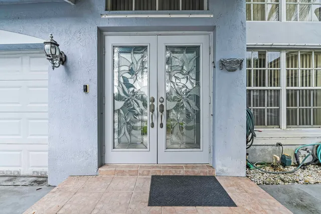 a view of a door and a window