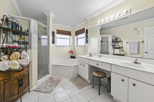 a spacious bathroom with a sink a vanity and a mirror