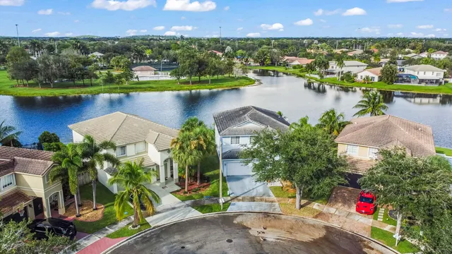 an aerial view of a house with a lake view