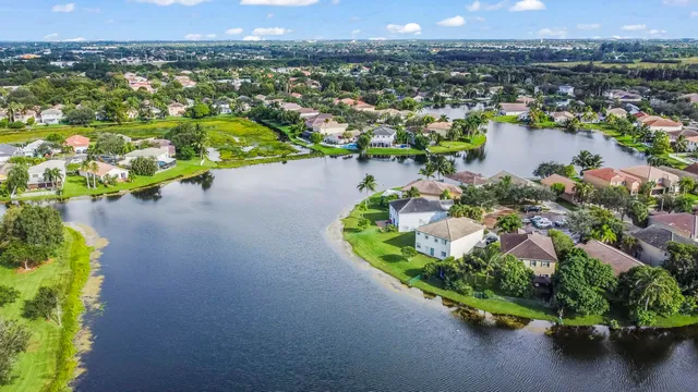 an aerial view of a house with a lake view
