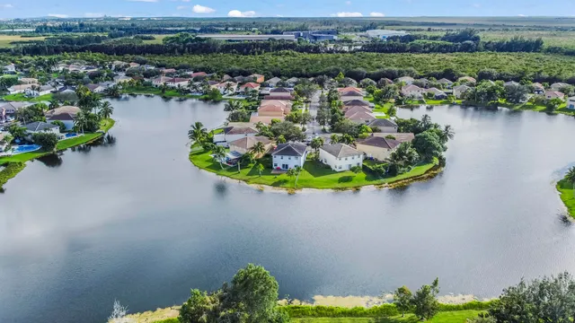 an aerial view of a house with a lake view