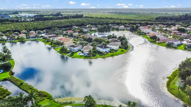a view of a house with a yard and table