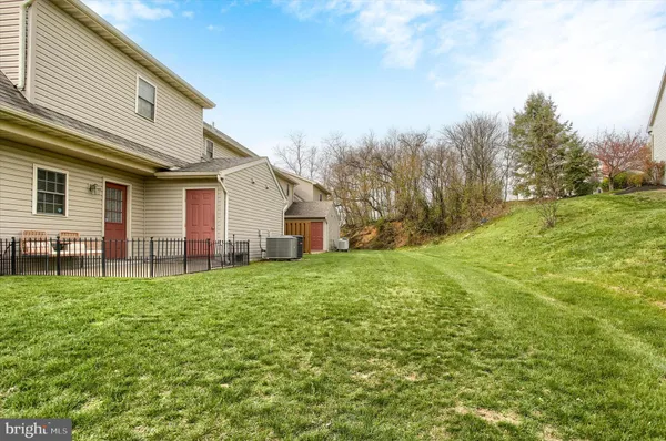 a view of a backyard of the house