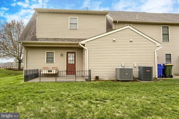 a front view of house with yard and seating space