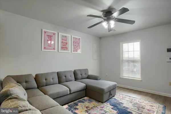 a living room with furniture and a window