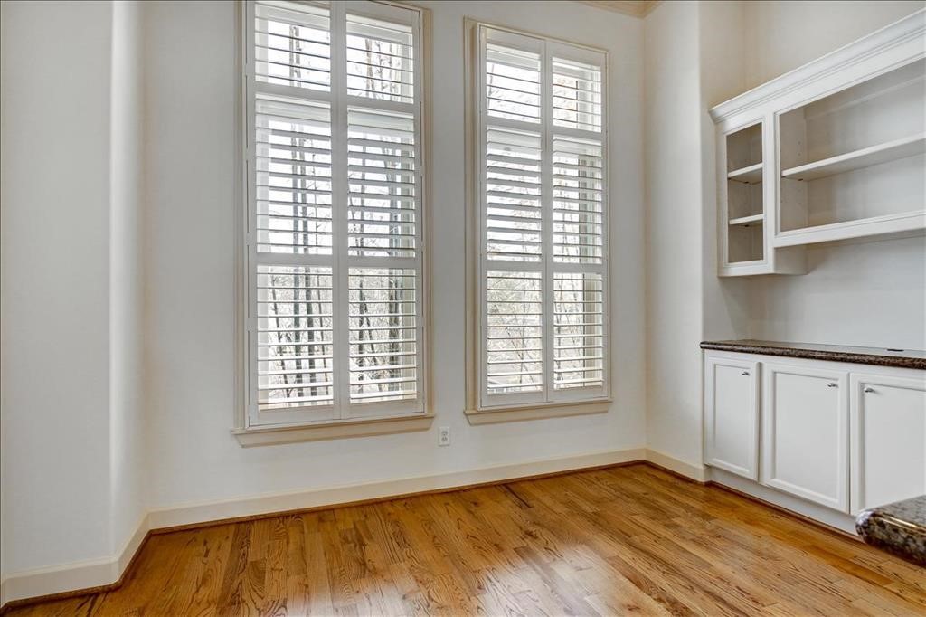 2318 Welch Street Houston, TX 77019 - Photo 16 of 35 Light & bright breakfast room with custom built-ins