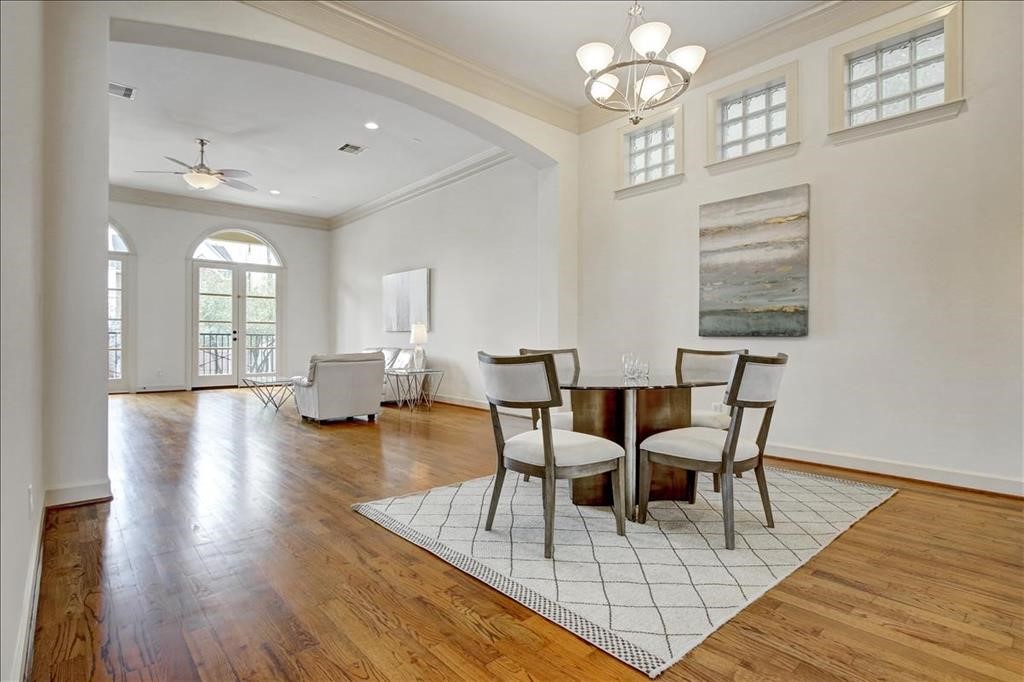 2318 Welch Street Houston, TX 77019 - Photo 17 of 35 Casually elegant dining room with double crownmolding & designer fixture