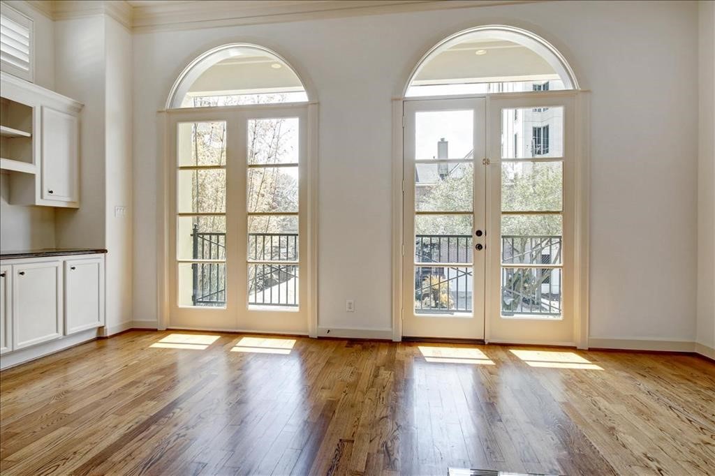2318 Welch Street Houston, TX 77019 - Photo 19 of 35 Overisze balconies on second & third floors with custom window treatments for privacy