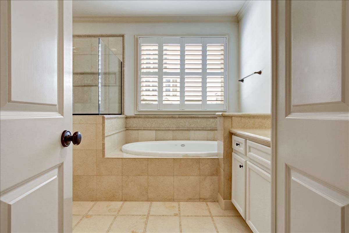2318 Welch Street Houston, TX 77019 - Photo 24 of 35 Oversize bath-tub, separate glass shower, Marble counters & Plantation shutters