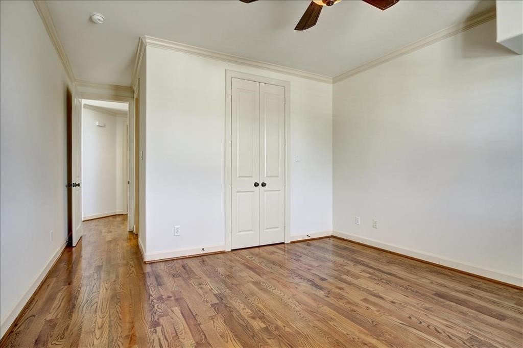 2318 Welch Street Houston, TX 77019 - Photo 28 of 35 Third bedroom with hardwoods, crownmolding, bronze fixtures & Plantation shutters