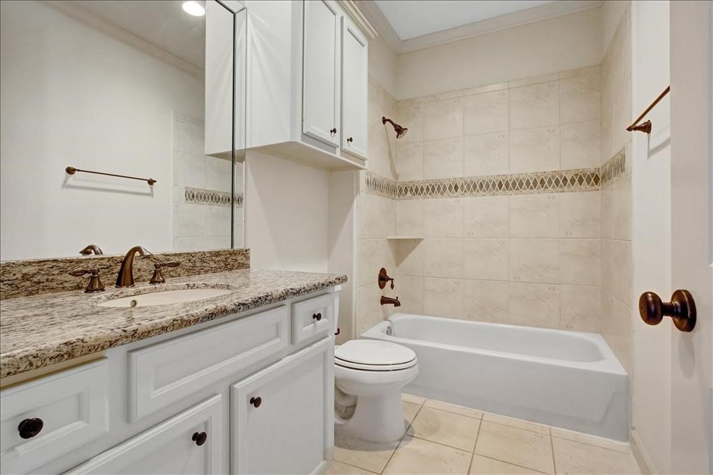 2318 Welch Street Houston, TX 77019 - Photo 29 of 35 Third bathroom with Granite counters, tile shower & bronze fixtures