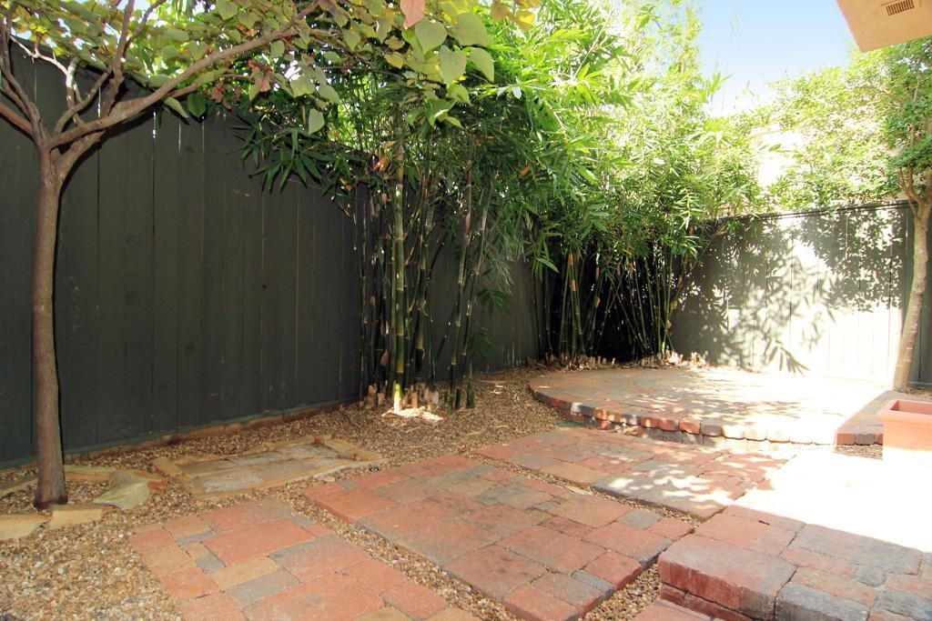 2318 Welch Street Houston, TX 77019 - Photo 34 of 35 Oversize backyard with Pavestone floors. Option outdoor furniture can stay