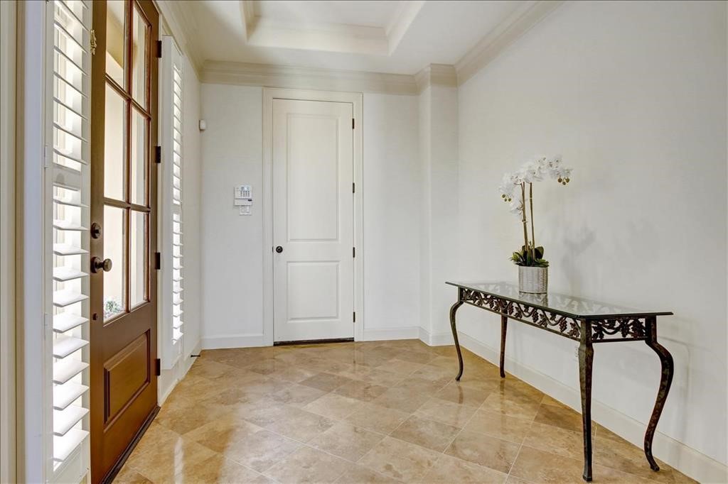 2318 Welch Street Houston, TX 77019 - Photo 4 of 35 Custom Travertine tile floors on entry foyer